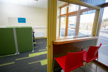 Two red chairs at counter in Feakle Digital Hub